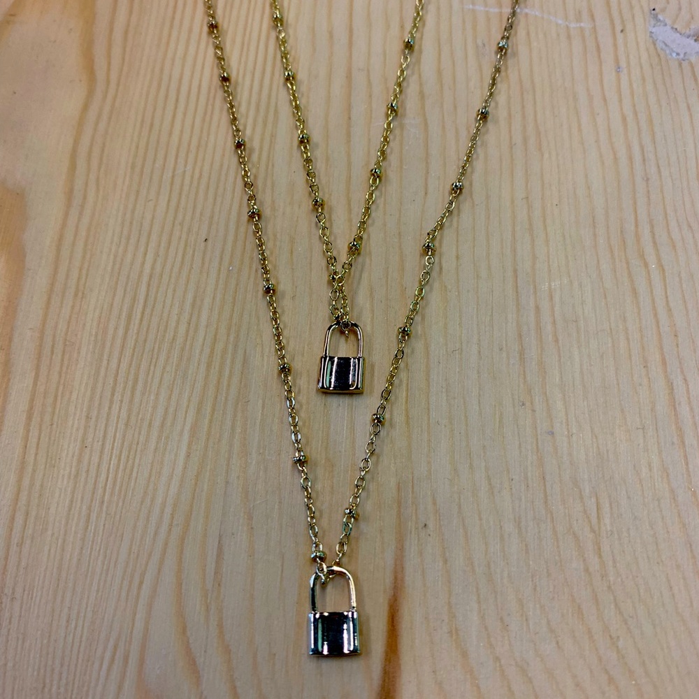 Locked Away Goldtone lock necklace perfect for layering